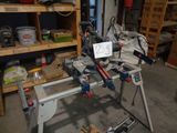 a picture of a workbench in a garage with tools on it