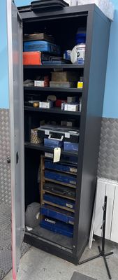 an image of a metal cabinet with tools in it