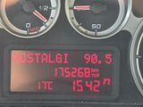 a digital clock on the dashboard of a car
