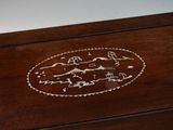 a wooden box that has a design on it