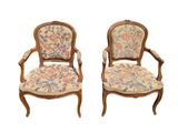 pair of louis xv style armchairs with floral upholstered upholstered cushions