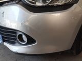 a close up of a car ' s headlight and front bumper