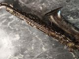 a saxophone that is laying on the ground