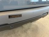 a close up of a car with a sticker on it ' s bumper