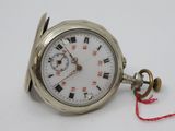 a silver pocket watch with roman numerals on it