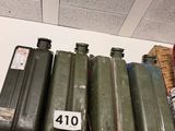 a shelf that has a lot of green containers on top of it