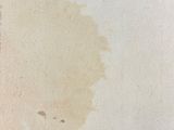 a brown stain on the paper on the table