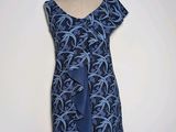 blue and black dress with a blue tie on a mannequin dummy