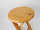 an image of a small wooden stool with a hole in the top