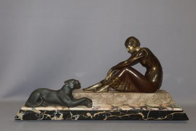 statue of a woman sitting on a marble base with a dog