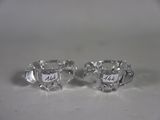 pair of silver plated sugar and creamers on a white surface