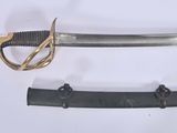 two different types of swords on display on a table