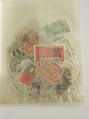 a bag of stamps on a table with a white background
