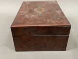 an old wooden box sitting on top of a table