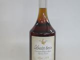 a bottle of wine that is sitting on a table