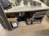 a workbench with a lot of tools on it