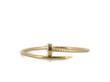 a gold ring with a small bar on top of it