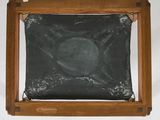an image of a wooden frame with a black chalkboard in it