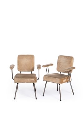 pair of mid - century chairs with upholstered backrests and metal legs