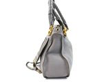 a close up of a purse with a handle on a white background