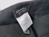 the label on the back of a chanel suit is attached to the back of a jacket