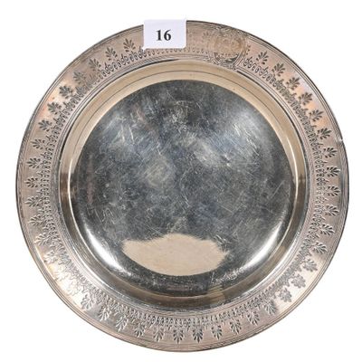a silver plate that has a picture of a man on it