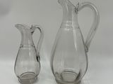 pair of clear glass vases on a white background
