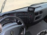 a dashboard of a truck with a steering wheel and dashboard controls