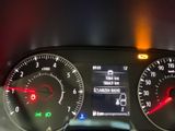 a close up of a car dashboard with various gauges