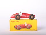 a red toy car sitting on top of a yellow box