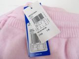 a pink sweater with a price tag attached to it
