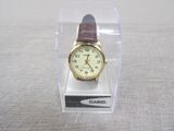 a watch that is in a clear box on a table