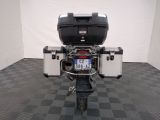a motorcycle that is parked on a checkered floor
