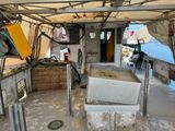 an image of a kitchen on a boat in the water
