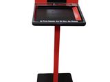 a red and black display stand with a piece of paper on it