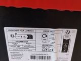 an image of a red and black box with a sticker on it
