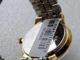 a watch that is sitting on a table with a barcode on it
