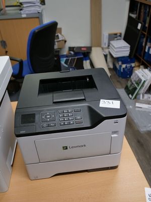 a printer that is sitting on a desk next to a printer