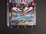 a close up of a pokemon card in a clear case