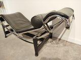 an image of a chaise lounger in the corner of a room