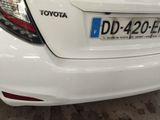 a close up of a white car with a license plate on it