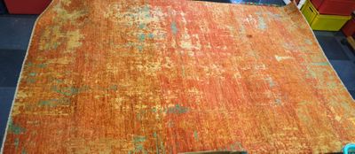 Tapis d'Orient dans les tons orangés.