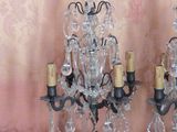 two crystal candelabs on a wooden table