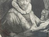 an old picture of a man reading a book in a wooden frame