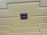 a piece of luggage that has a black label on it