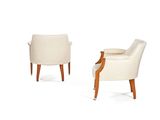 pair of armchairs with upholstered backrests and wooden legs