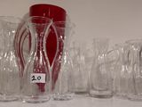 a lot of glass vases sitting on a table