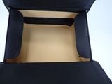 a black suitcase that is open on a white surface
