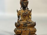 an image of a statue of a person sitting in a lotus position