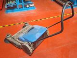 an image of a floor scruber in a warehouse